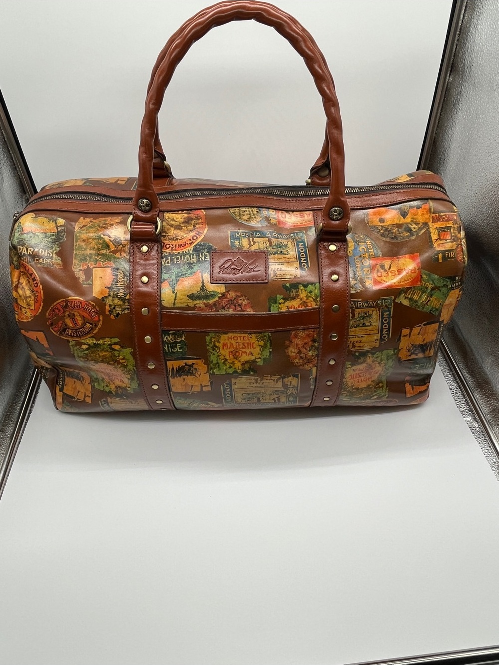 Patricia Nash Milano leather weekender bag. Leather. Travel sticker print.